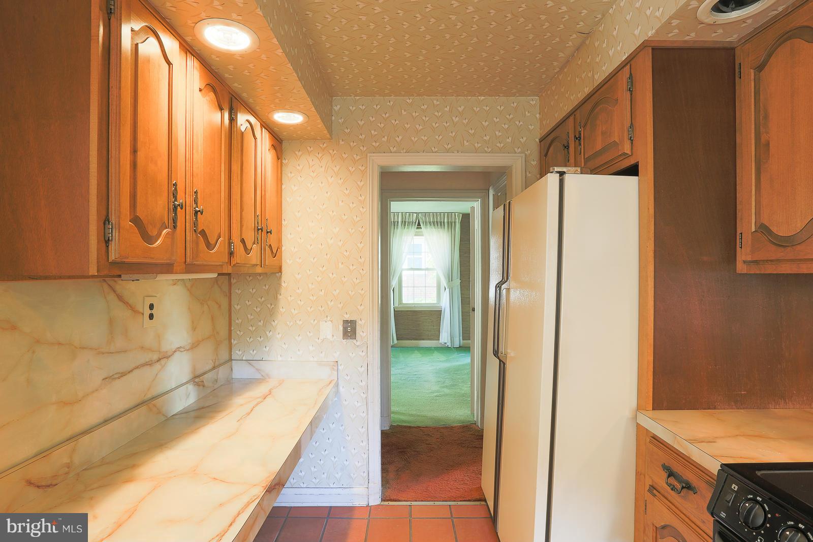 7005 Deerfield Road Pikesville, MD 21208 - Photo 4 of 30 Kitchen with wood cabinets