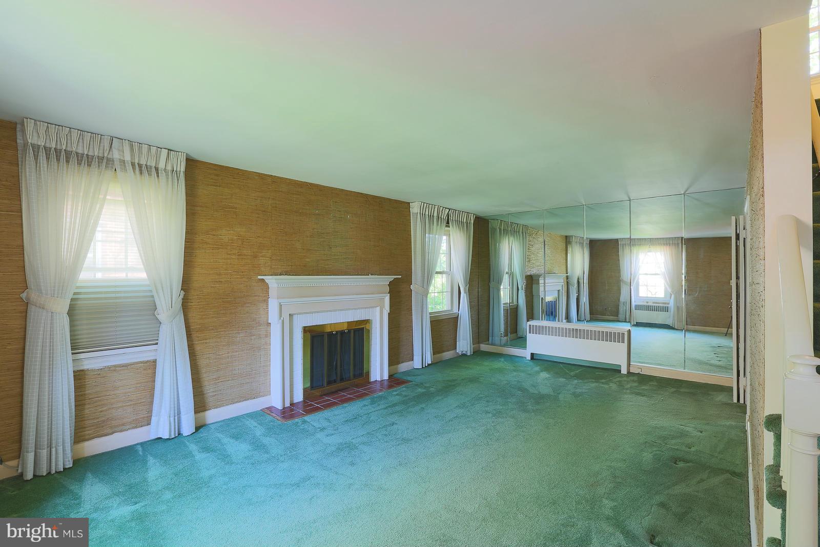 7005 Deerfield Road Pikesville, MD 21208 - Photo 6 of 30 Living Room wood burning fireplace