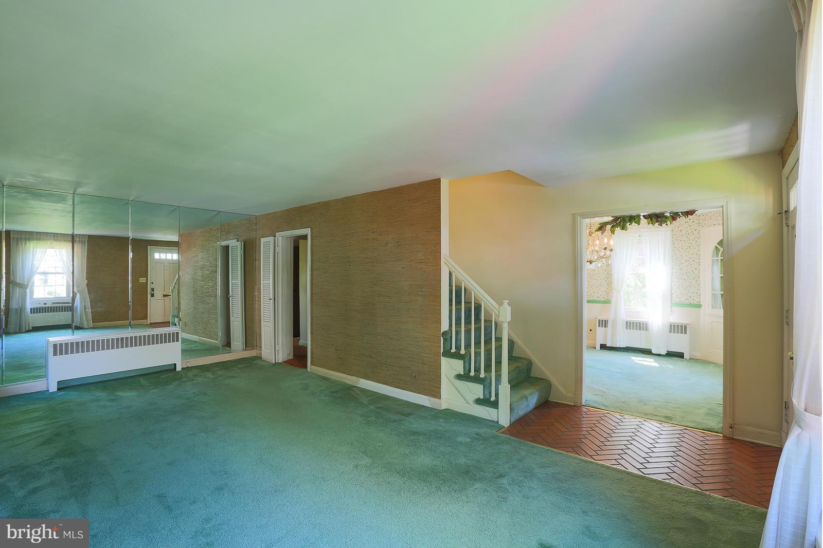 7005 Deerfield Road Pikesville, MD 21208 - Photo 7 of 30 Living Room carpet over wood floors.