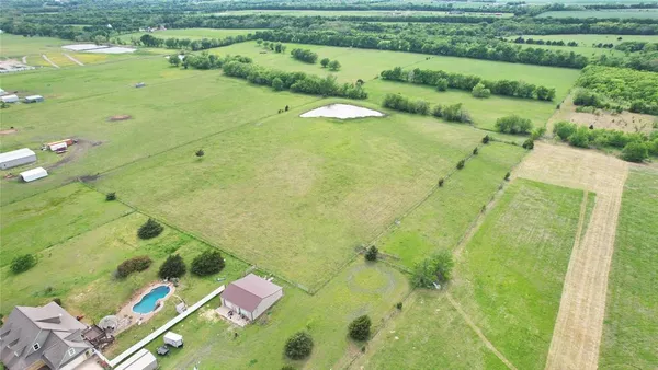 a view of a swimming pool with a yard