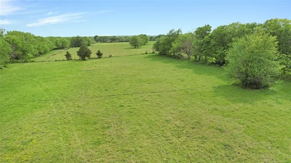 a view of a big yard with green space