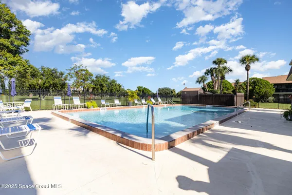 a view of a swimming pool with a patio