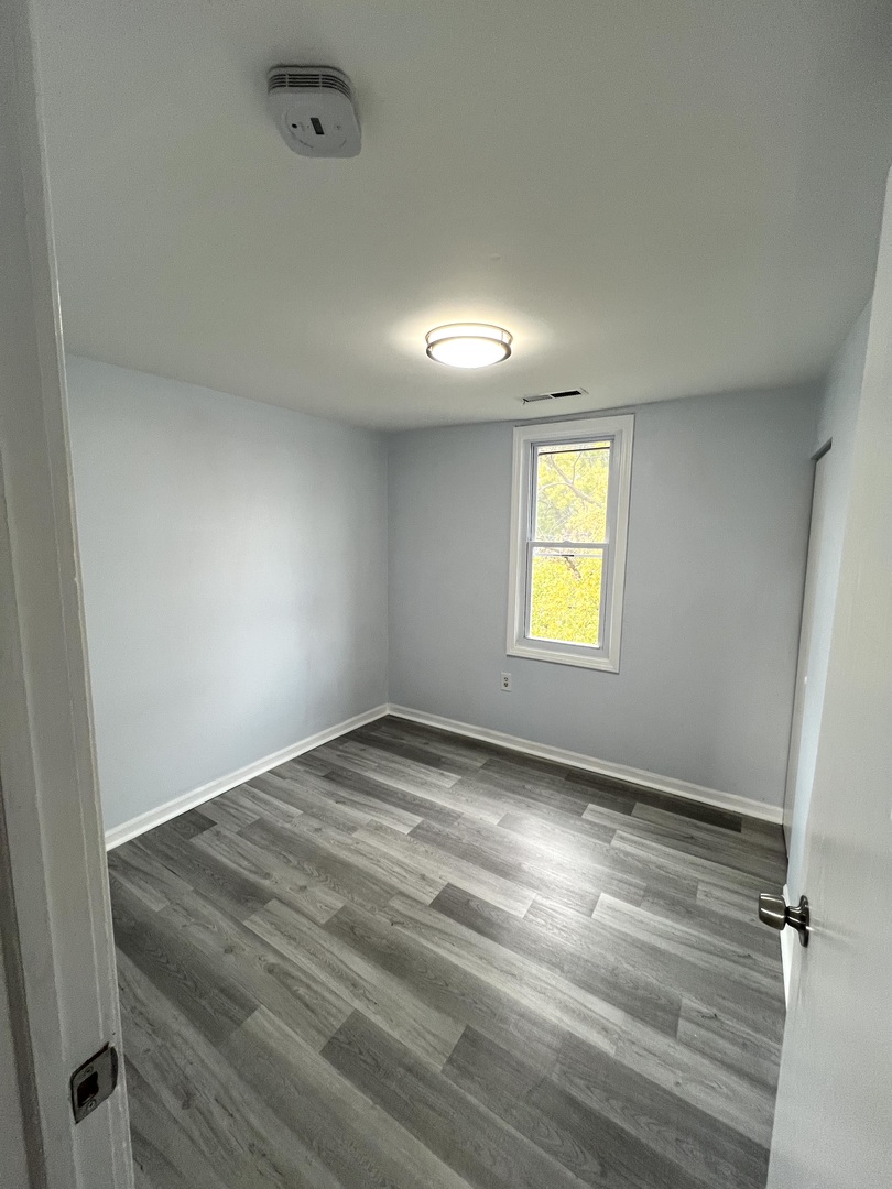 3002 Green Street, Unit 2 Steger, IL 60475 - Photo 23 of 31 a view of an empty room and window