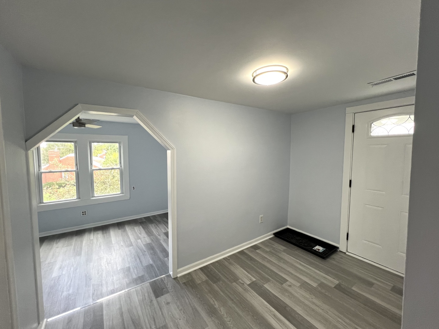 3002 Green Street, Unit 2 Steger, IL 60475 - Photo 7 of 31 an empty room with wooden floor and windows