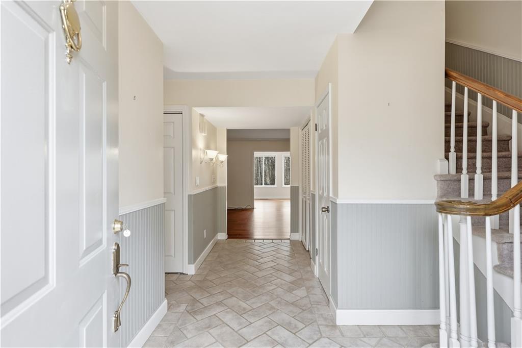 6500 Gaines Ferry Road, Unit I4 Flowery Branch, GA 30542 - Photo 12 of 29 a view of a hallway with wooden shelves and entryway