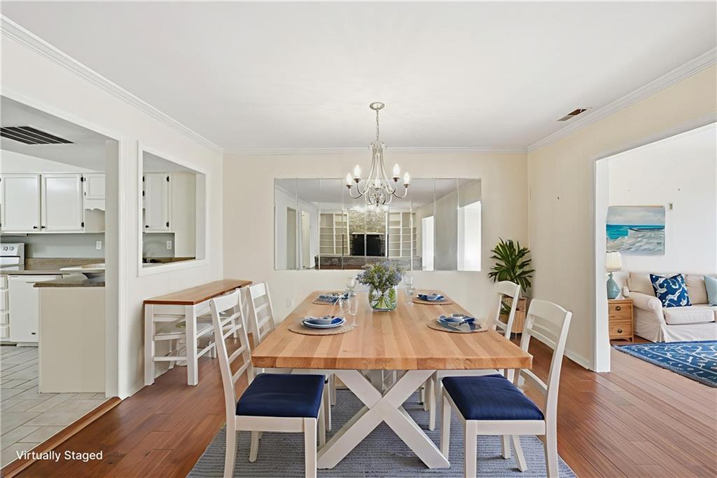 6500 Gaines Ferry Road, Unit I4 Flowery Branch, GA 30542 - Photo 13 of 29 a view of a dining room with furniture window and wooden floor