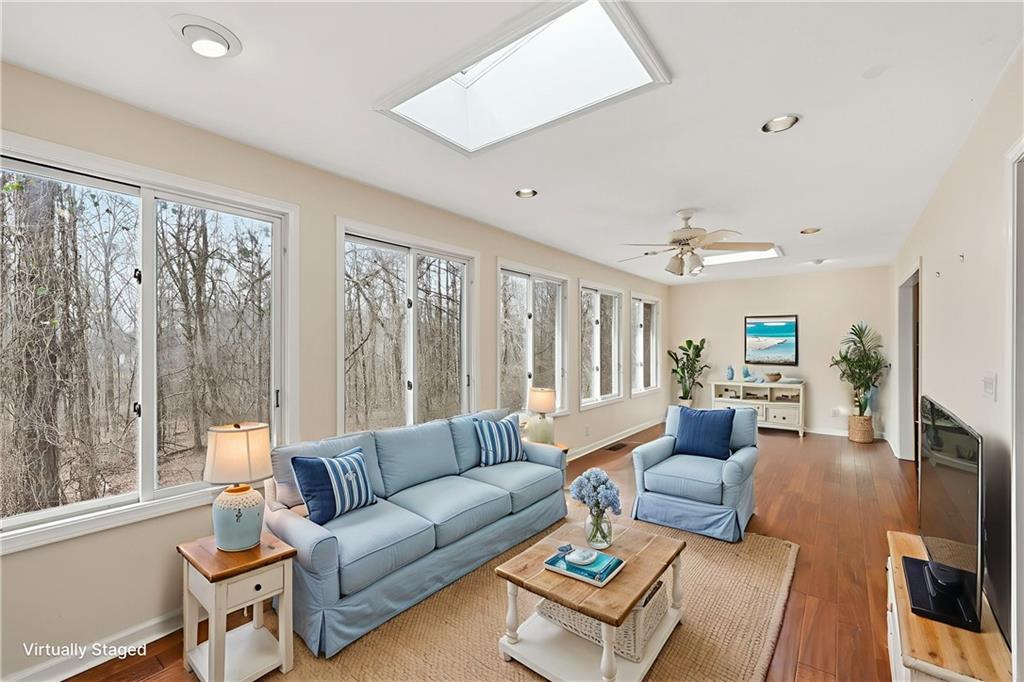 6500 Gaines Ferry Road, Unit I4 Flowery Branch, GA 30542 - Photo 17 of 29 a living room with furniture and a large window