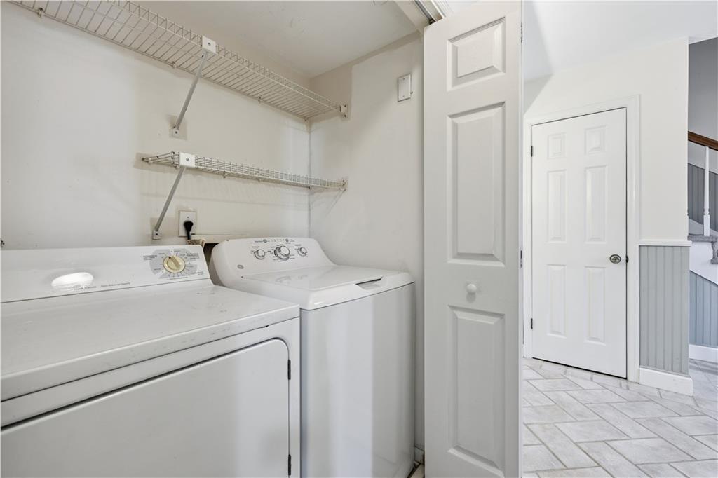 6500 Gaines Ferry Road, Unit I4 Flowery Branch, GA 30542 - Photo 28 of 29 a utility room with dryer and washer
