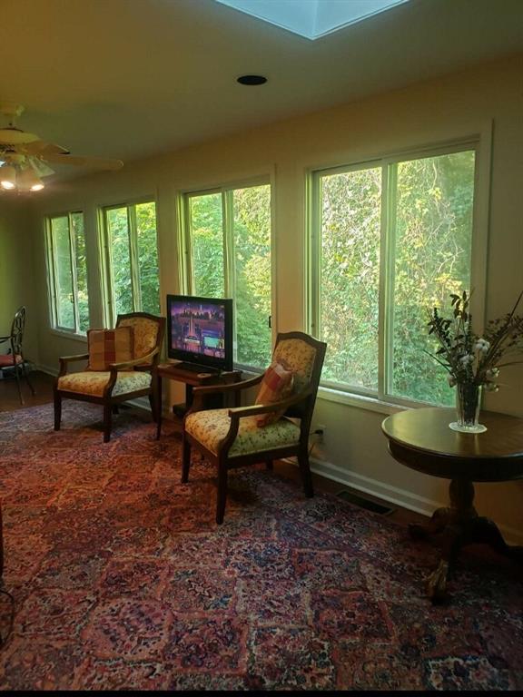 6500 Gaines Ferry Road, Unit I4 Flowery Branch, GA 30542 - Photo 29 of 29 a living room with furniture and a window