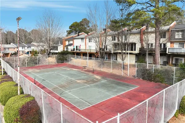 a view of a hallway with wooden shelves and entryway