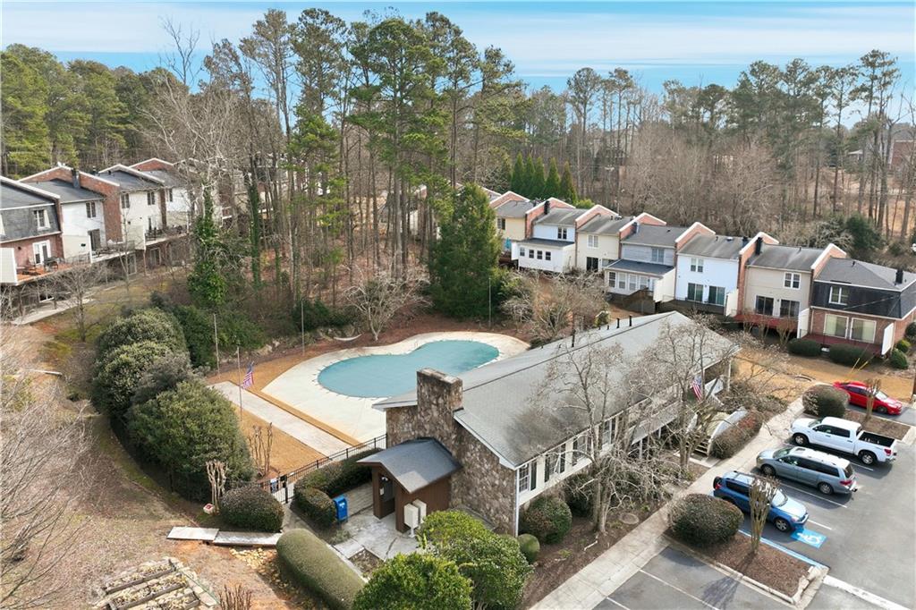 6500 Gaines Ferry Road, Unit I4 Flowery Branch, GA 30542 - Photo 10 of 29 an aerial view of a house with garden space and street view