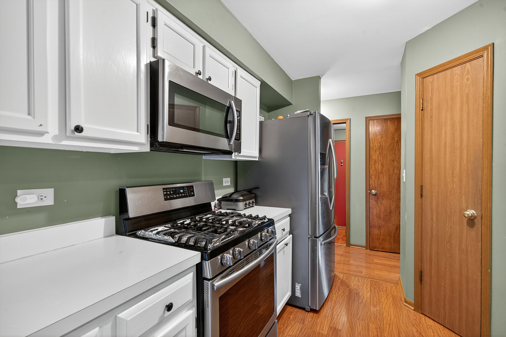 255 Braemar Bolingbrook, IL 60440 - Photo 12 of 36 a kitchen with stainless steel appliances granite countertop a refrigerator and a stove top oven