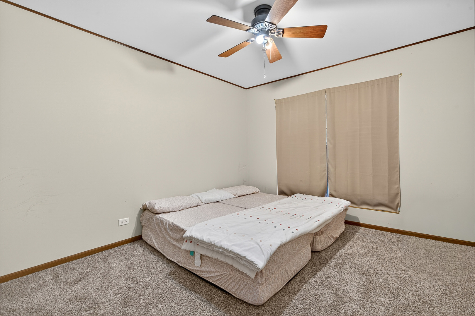 255 Braemar Bolingbrook, IL 60440 - Photo 14 of 36 a bedroom with a bed and a chandelier