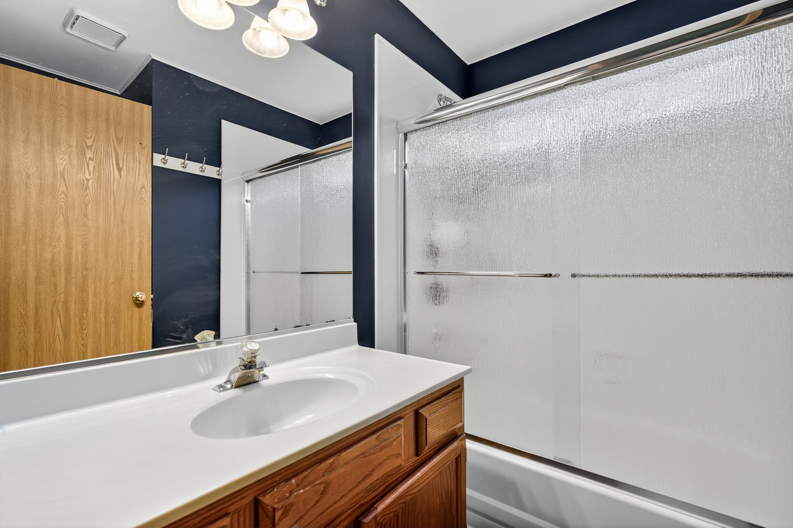 255 Braemar Bolingbrook, IL 60440 - Photo 15 of 36 a bathroom with a sink and a mirror