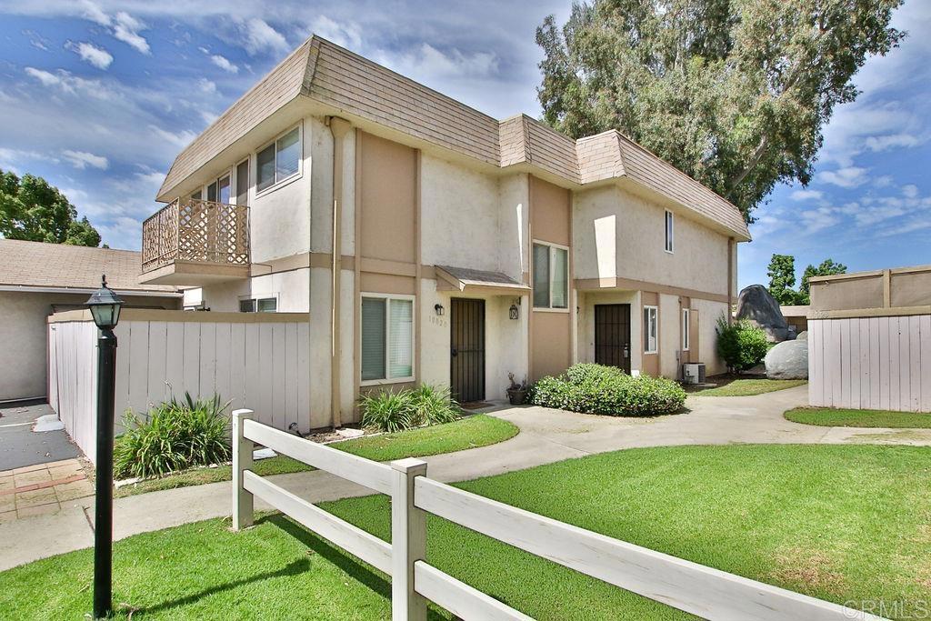 10022 Great Rock Road Santee, CA 92071 - Photo 1 of 32 a front view of a house with a yard