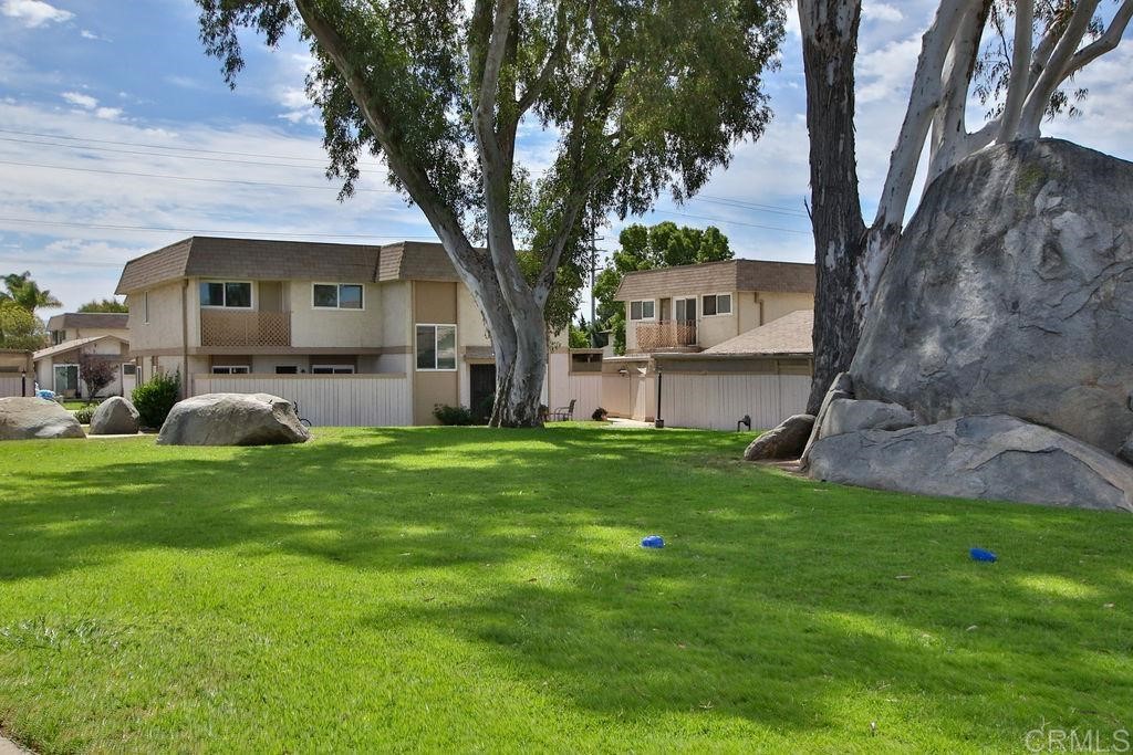 10022 Great Rock Road Santee, CA 92071 - Photo 2 of 32 a front view of house with yard and green space