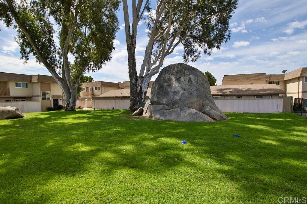 10022 Great Rock Road Santee, CA 92071 - Photo 25 of 32 a front view of a house with garden