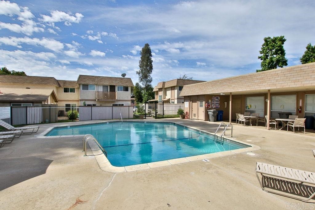 10022 Great Rock Road Santee, CA 92071 - Photo 26 of 32 a view of a house with swimming pool and sitting area