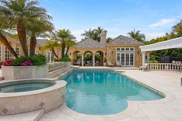 a view of a house with swimming pool