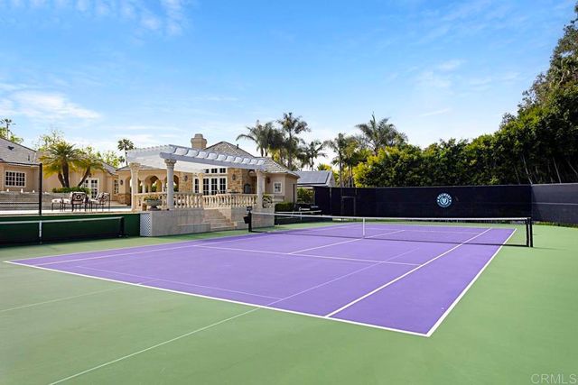 a kitchen with a table and chairs in it