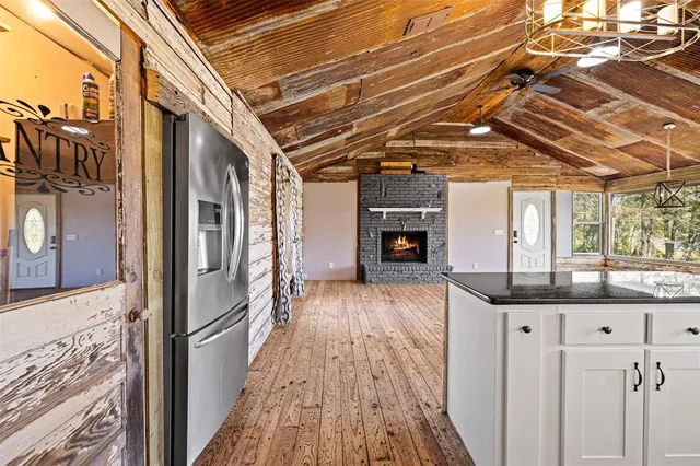 a view of backyard with a tub and wooden floor