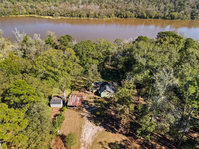 an aerial view of a houses with a lake view