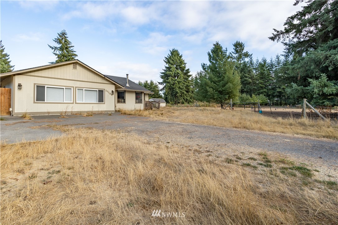 17102 Weaver Lane Southwest Rochester, WA 98579 - Photo 3 of 29 a view of a house with a yard