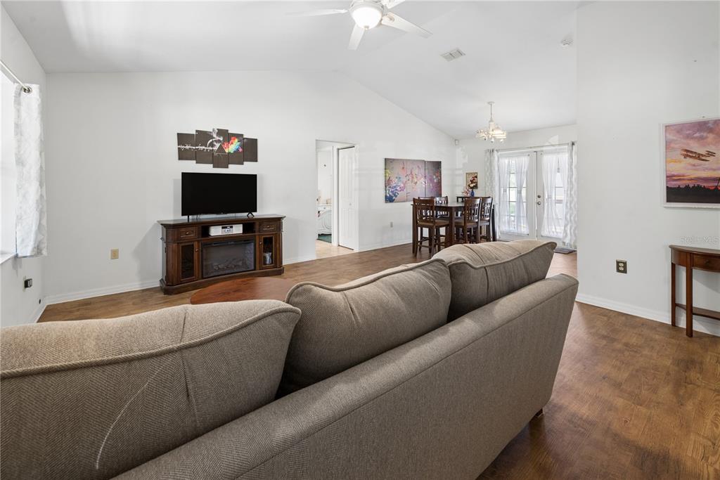 1750 Southwest 15th Street Bell, FL 32619 - Photo 3 of 34 a living room with furniture and a flat screen tv