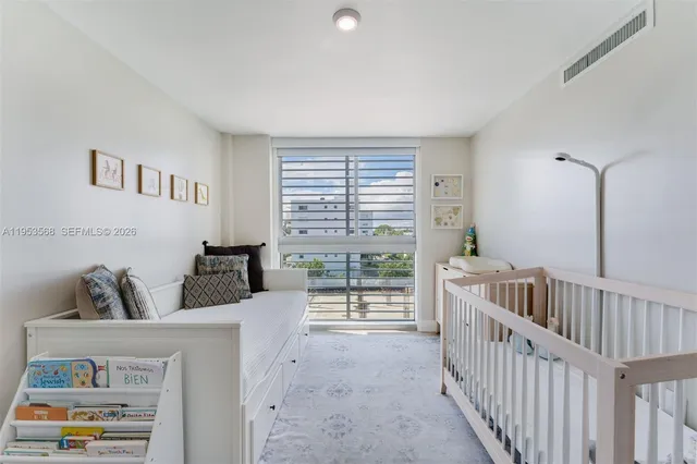 a bedroom with furniture and a window