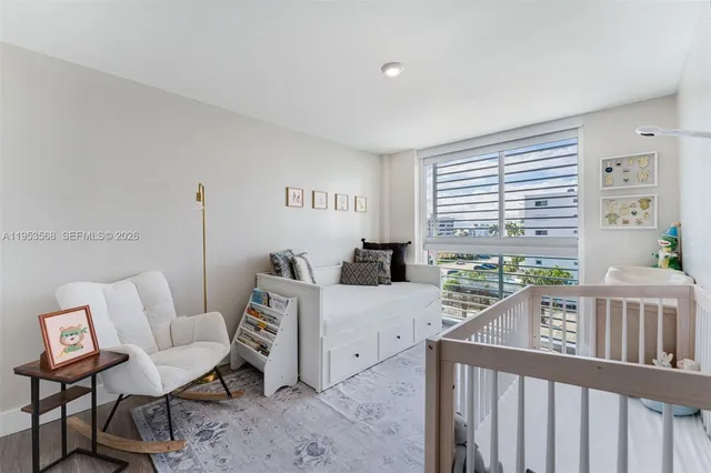 a bedroom with furniture and a window