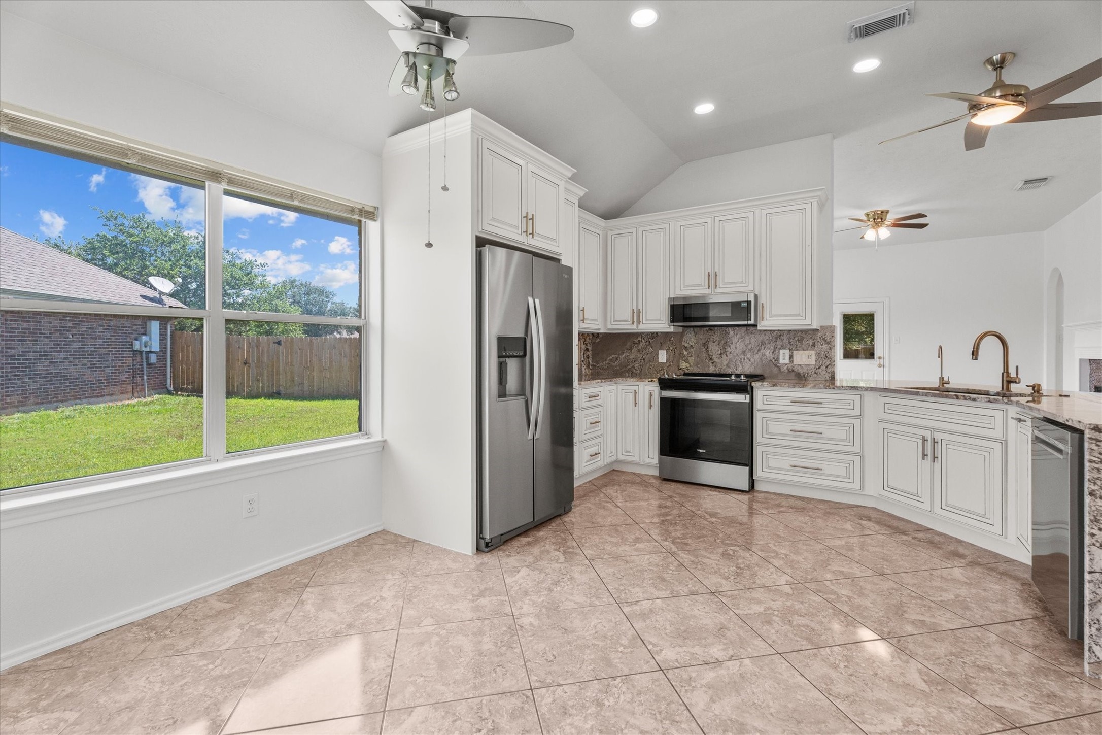 2507 Grayfeather Court Spring, TX 77388 - Photo 11 of 37 Spacious kitchen with modern appliances, granite countertops, and ample cabinetry.