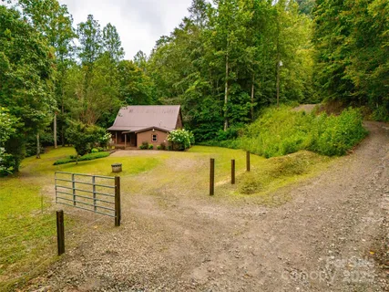 a view of a house with a big yard