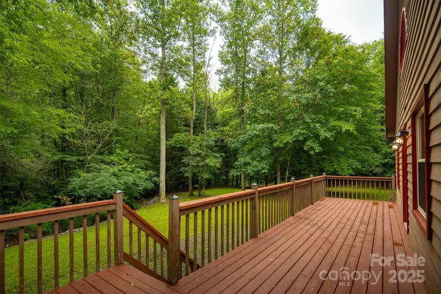 a view of balcony with deck and trees
