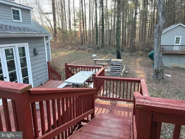 a view of a patio with a table and chairs