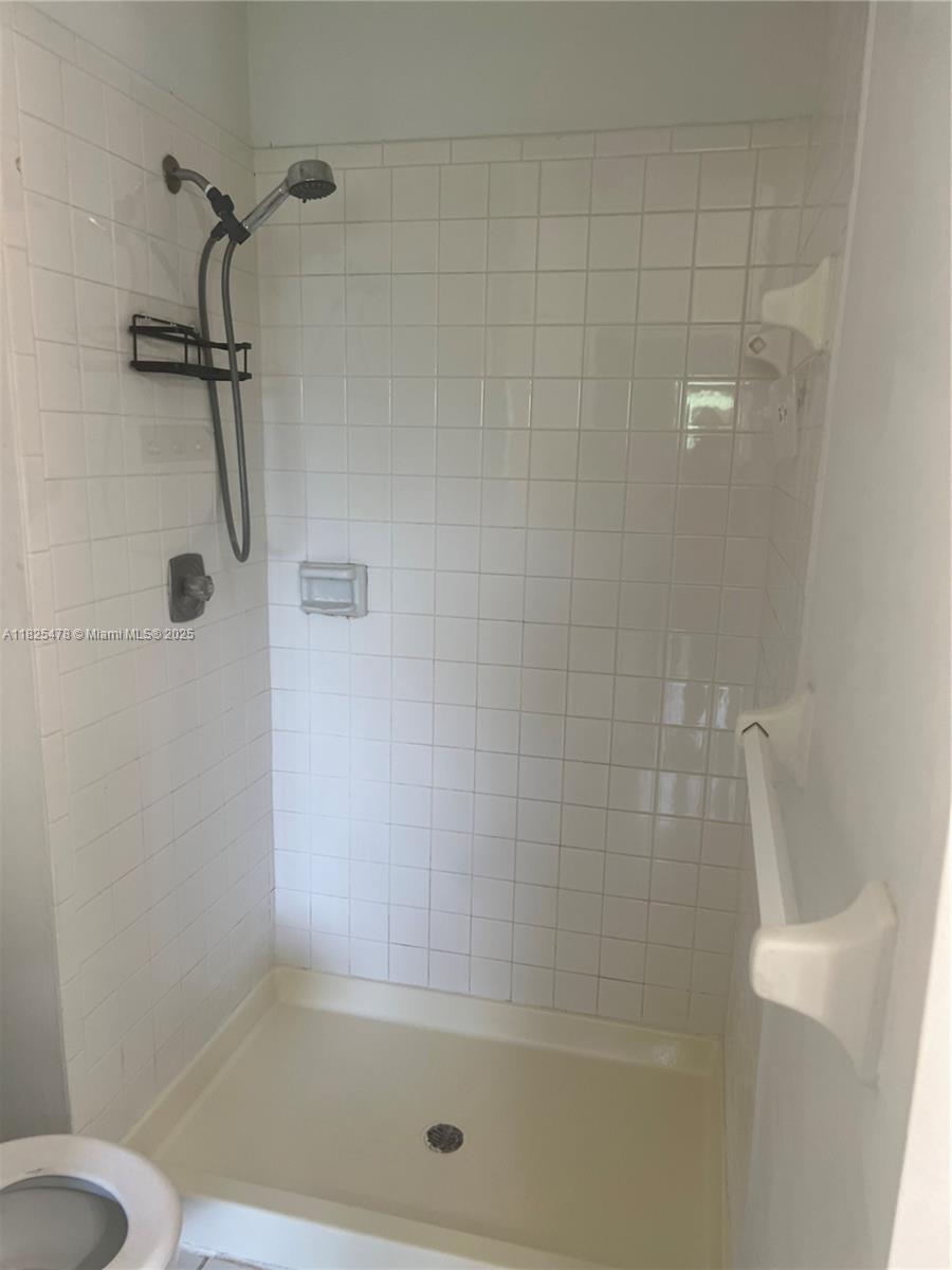 7670 Southwest 152nd Avenue, Unit 1202 Miami, FL 33193 - Photo 2 of 9 a bathroom with a shower