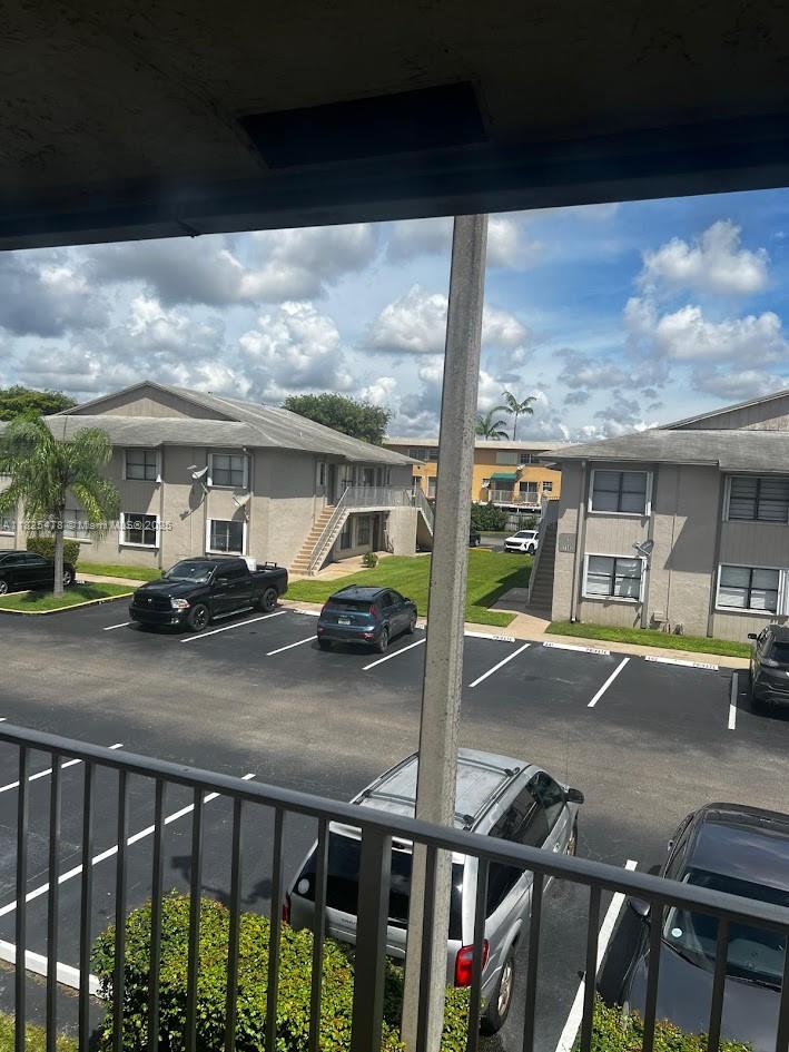 7670 Southwest 152nd Avenue, Unit 1202 Miami, FL 33193 - Photo 3 of 9 a view of a porch with furniture and backyard