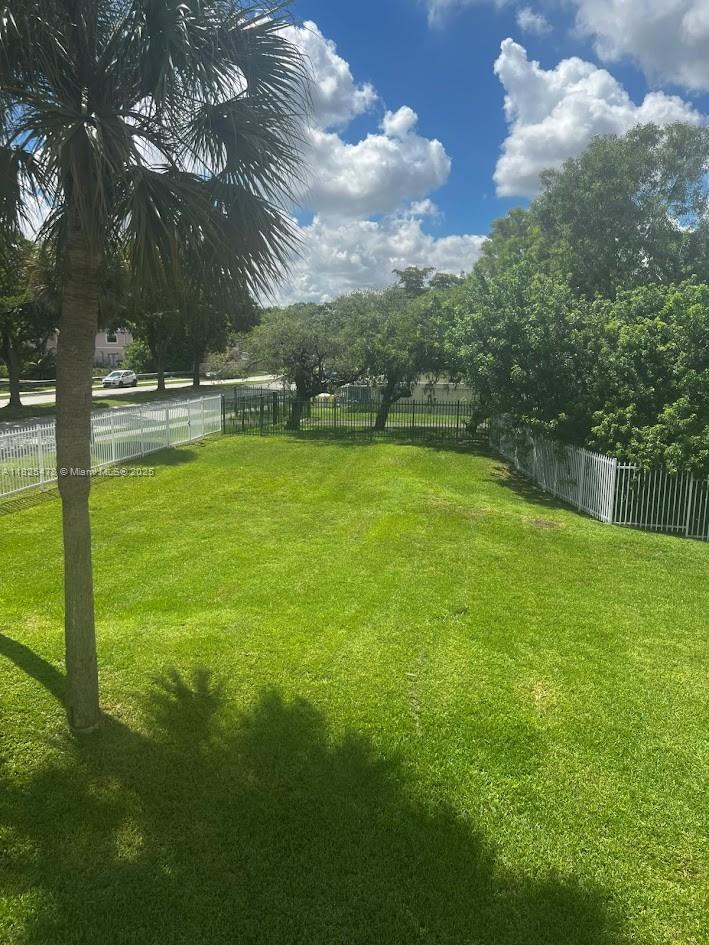 7670 Southwest 152nd Avenue, Unit 1202 Miami, FL 33193 - Photo 7 of 9 a view of an outdoor space and swimming pool