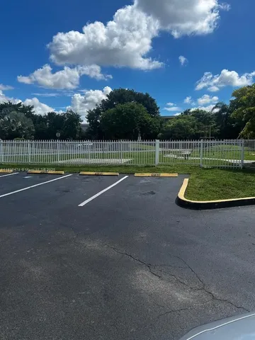 a view of a swimming pool with a yard