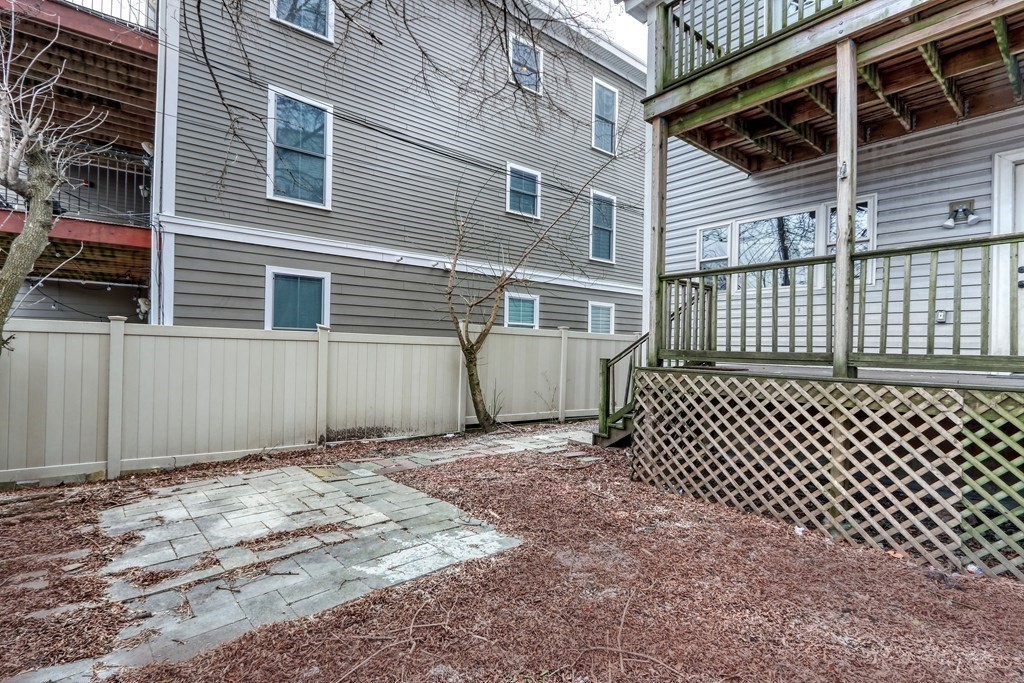 12 Jenkins Street Boston, MA 02127 - Photo 15 of 16 a view of a house with a wooden fence