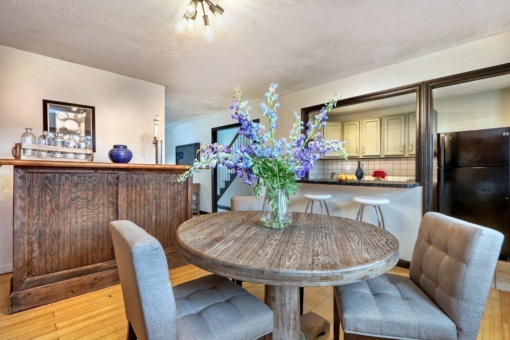 12 Jenkins Street Boston, MA 02127 - Photo 3 of 16 a view of a dining room with furniture and wooden floor