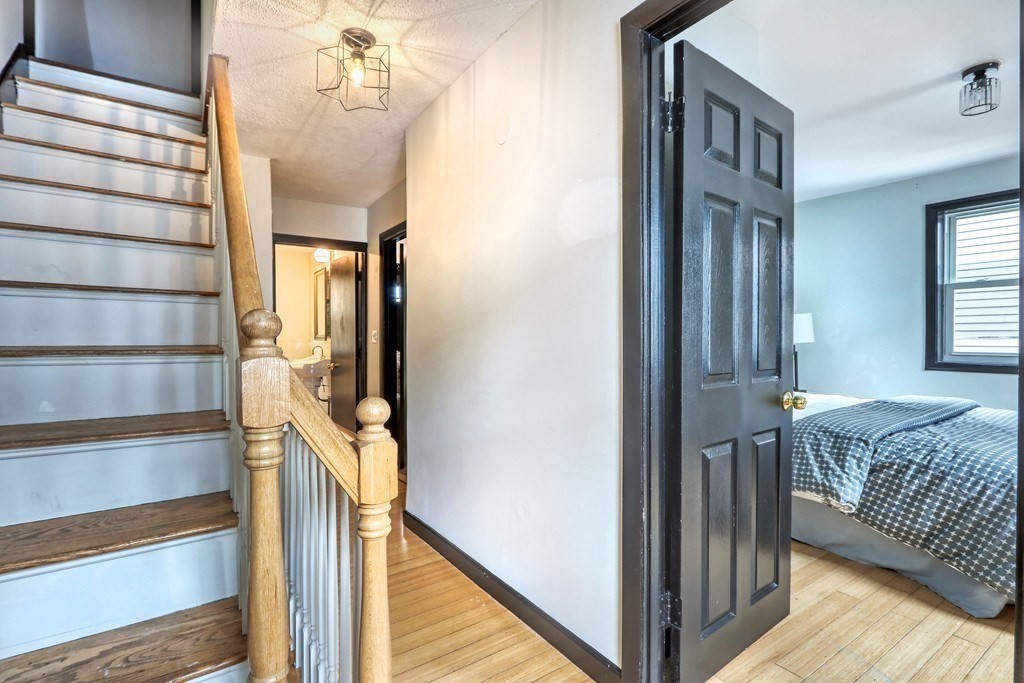 12 Jenkins Street Boston, MA 02127 - Photo 6 of 16 a view of a hallway with wooden floor and windows