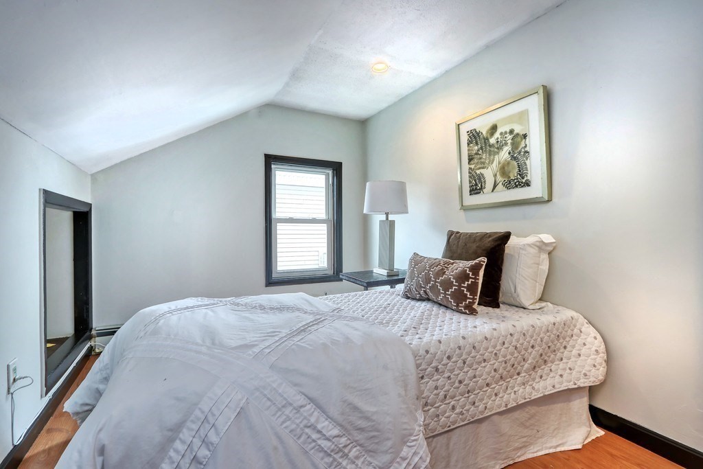 12 Jenkins Street Boston, MA 02127 - Photo 9 of 16 a bedroom with a large bed and a window