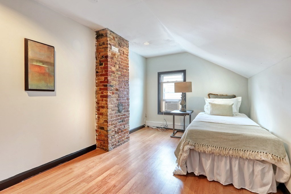 12 Jenkins Street Boston, MA 02127 - Photo 10 of 16 a bedroom with a bed and a window