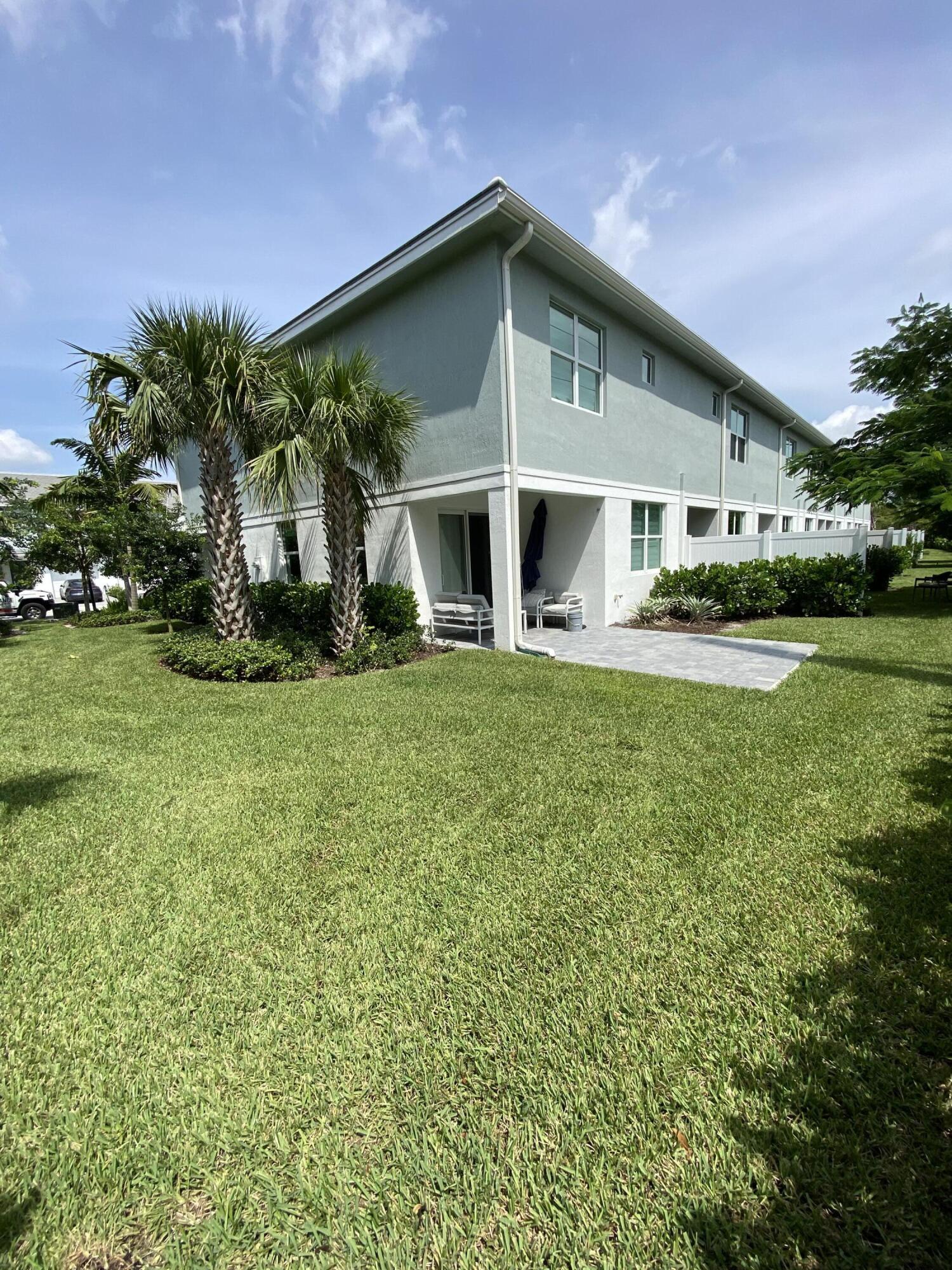 562 Parsons Way Deerfield Beach, FL 33442 - Photo 9 of 15 a front view of a house with garden