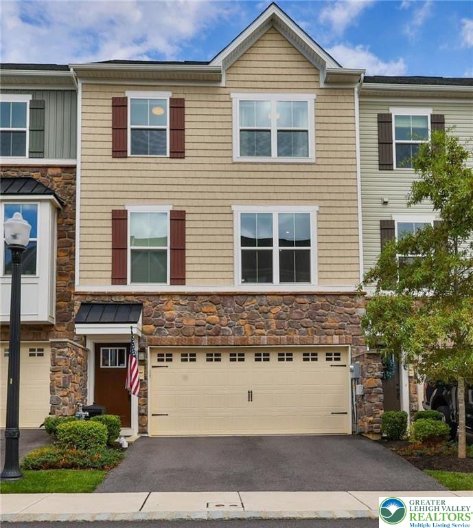 2356 Raya Way Easton, PA 18045 - Photo 1 of 28 Multi-textured exterior finishes accent this modern townhome complete with an attached two-car garage.