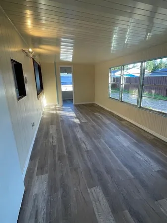 a view of empty room with large window