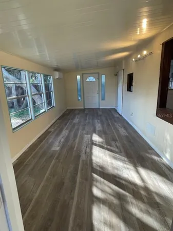 a bathroom with a sink toilet and window