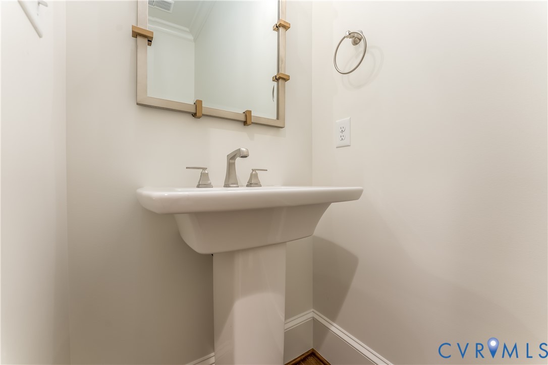 2707 North Otterdale Road Midlothian, VA 23113 - Photo 11 of 21 a bathroom with a sink and a mirror