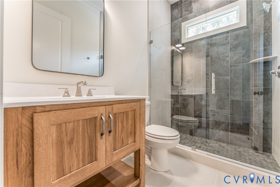2707 North Otterdale Road Midlothian, VA 23113 - Photo 14 of 21 a bathroom with a sink a toilet and shower