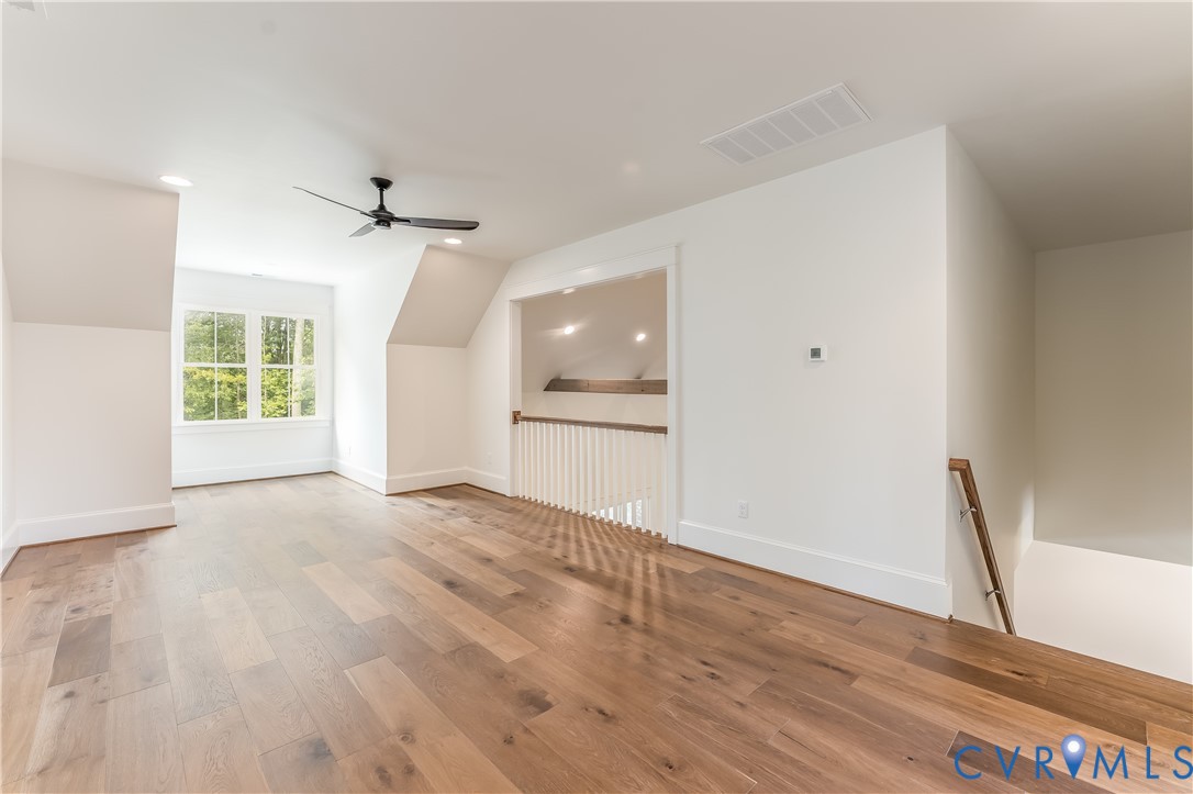 2707 North Otterdale Road Midlothian, VA 23113 - Photo 16 of 21 a view of an empty room with a window and wooden floor